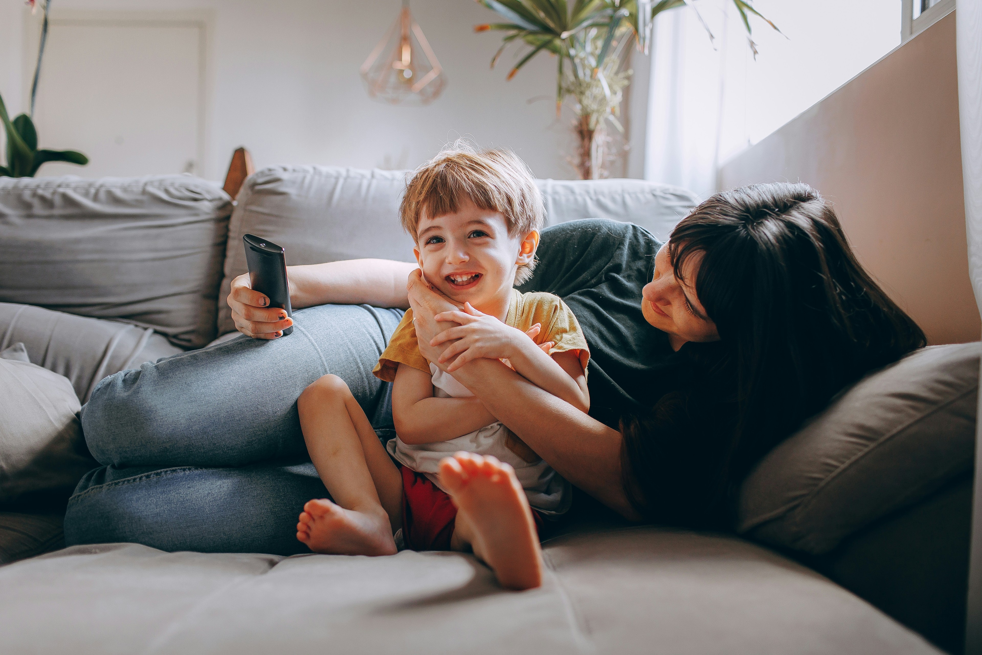 Mother and Child watching television together